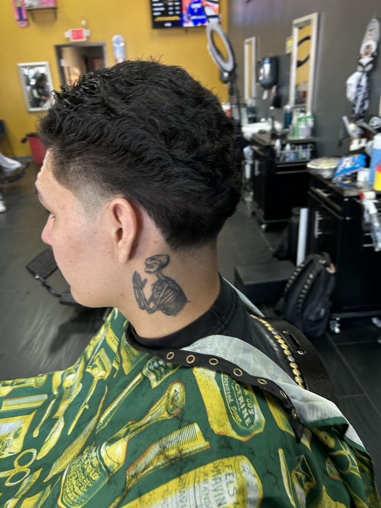 Man getting a haircut in barbershop