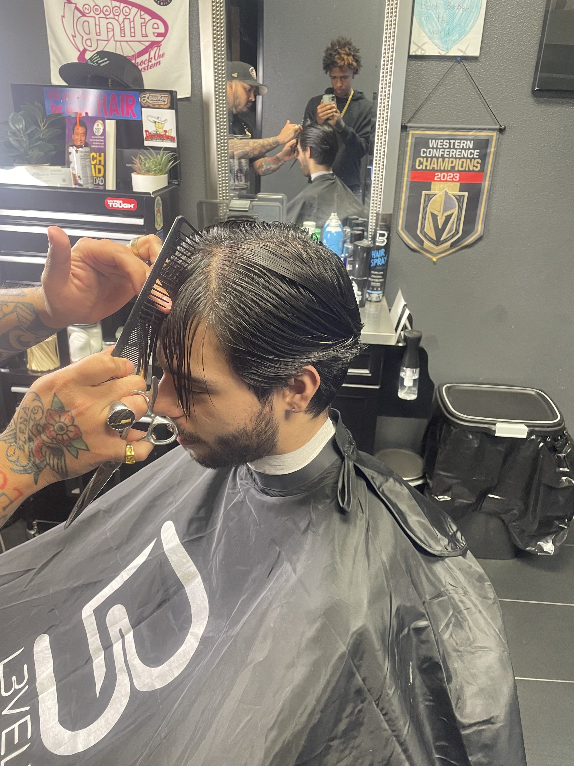 Man getting a haircut in barbershop