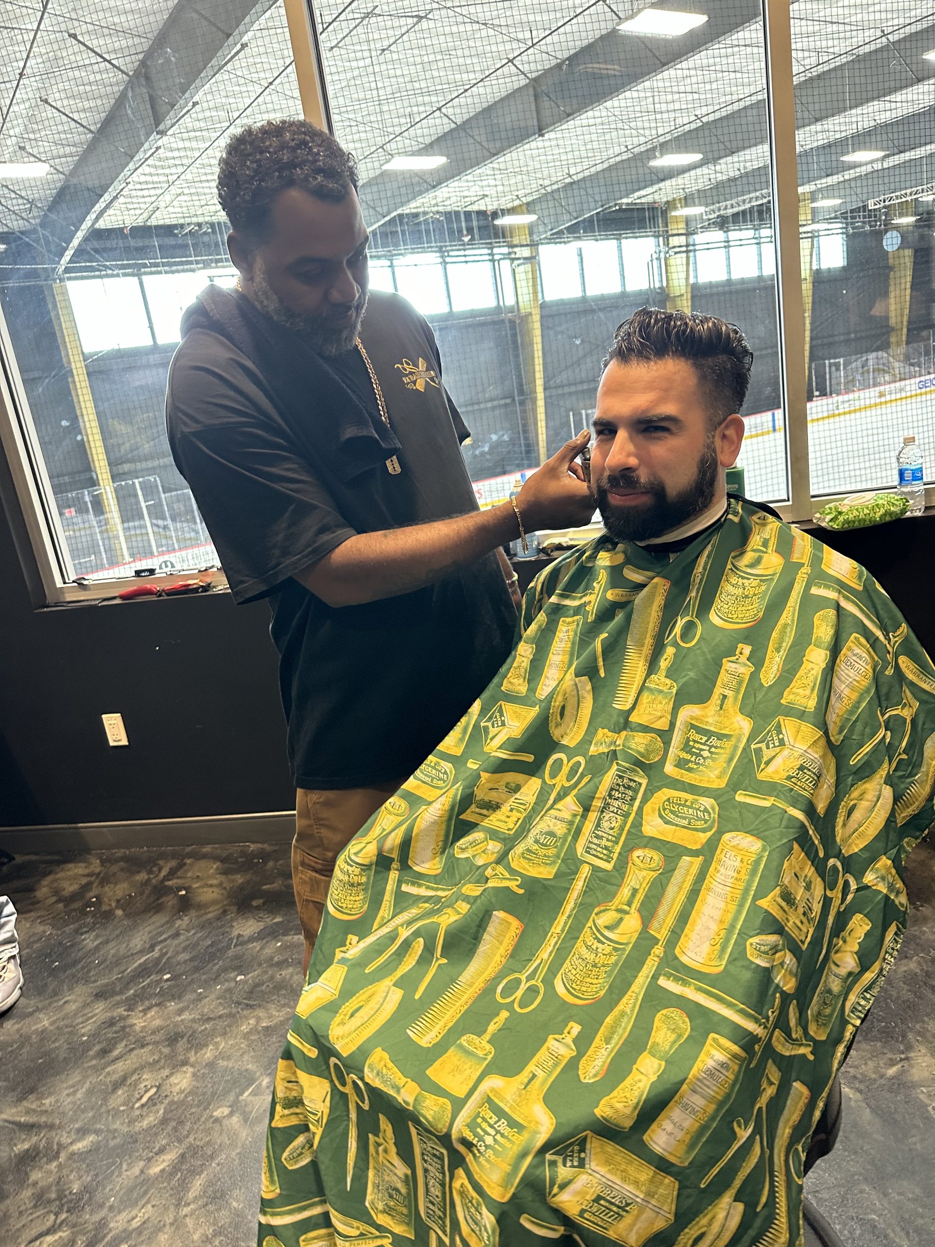 Man getting a beard trim in barbershop